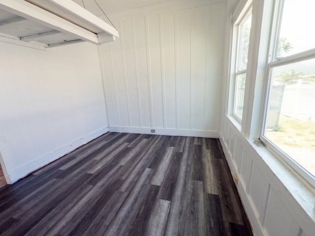 225 S Papa Ave, Kahului, HI 96732 - unfurnished room with dark wood finished floors, a decorative wall, and baseboards