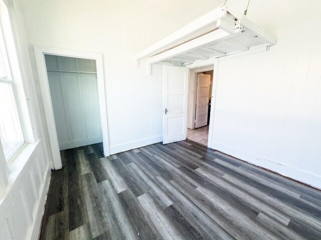 225 S Papa Ave, Kahului, HI 96732 - unfurnished bedroom featuring wood finished floors, a closet, and baseboards