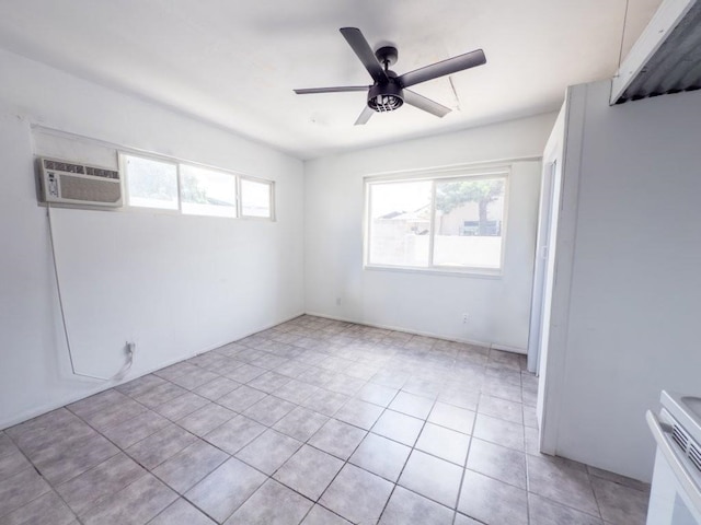 225 S Papa Ave, Kahului, HI 96732 - empty room featuring an AC wall unit, ceiling fan, and light tile patterned flooring