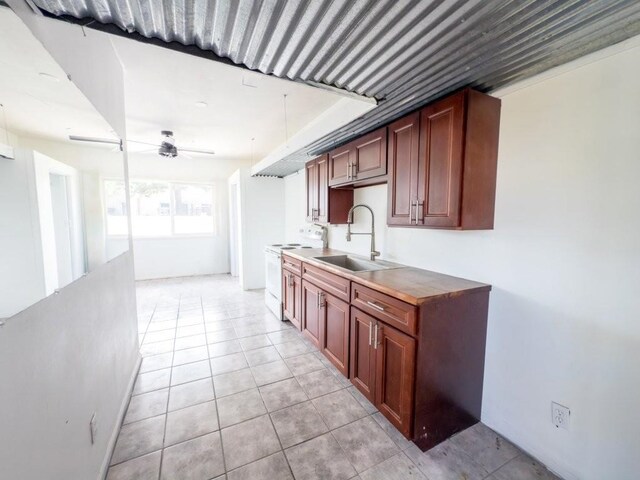 225 S Papa Ave, Kahului, HI 96732 - kitchen with white electric range, a sink, ceiling fan, and light tile patterned floors