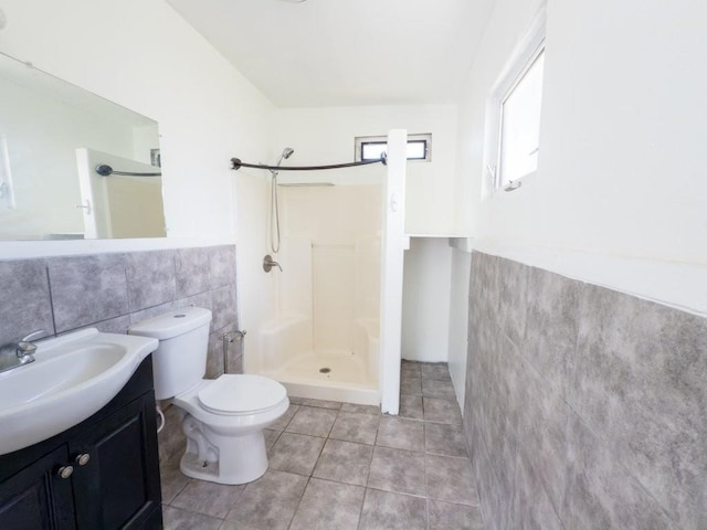 225 S Papa Ave, Kahului, HI 96732 - full bath featuring tile walls, a shower stall, vanity, toilet, and tile patterned floors