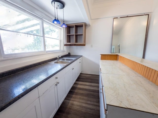 225 S Papa Ave, Kahului, HI 96732 - kitchen with a sink, dark wood-type flooring, white cabinetry, hanging light fixtures, and dark countertops
