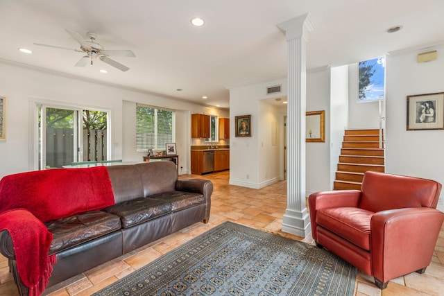 tiled living room featuring ceiling fan, ornamental molding, and ornate columns