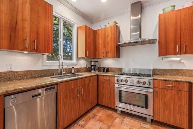 kitchen with wall chimney exhaust hood, sink, stone countertops, and stainless steel appliances