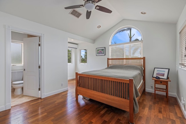 bedroom featuring ceiling fan, lofted ceiling, connected bathroom, and hardwood / wood-style flooring