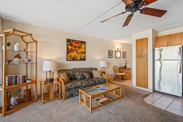2495 S Kihei Rd Unit 248, Kihei, HI 96753 - living area with ceiling fan, a textured ceiling, light colored carpet, and light tile patterned flooring