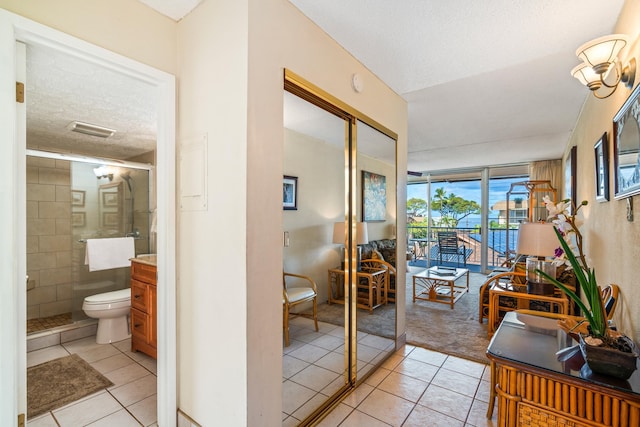 2495 S Kihei Rd Unit 248, Kihei, HI 96753 - corridor with light tile patterned floors and a textured ceiling