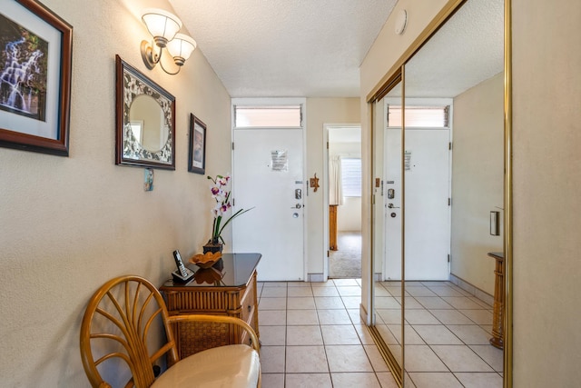 2495 S Kihei Rd Unit 248, Kihei, HI 96753 - foyer entrance featuring a textured ceiling and light tile patterned flooring