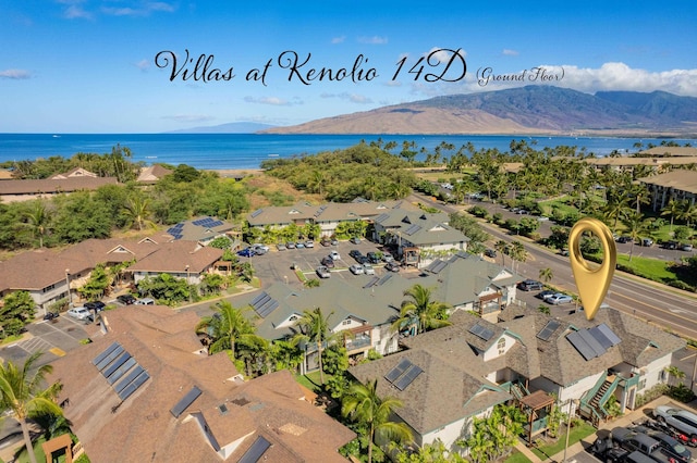 birds eye view of property featuring a water and mountain view