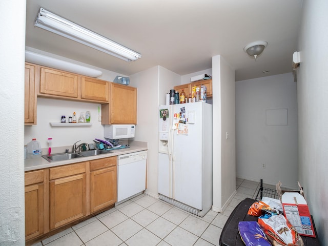 kitchen featuring sink, white appliances, and light tile patterned floors