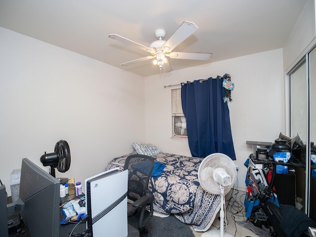 bedroom featuring ceiling fan and a closet