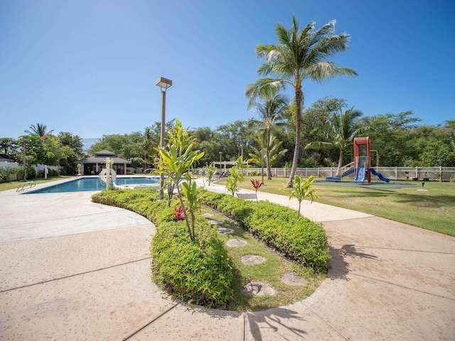 view of community featuring a playground and a pool