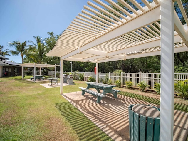 surrounding community featuring a pergola, a patio area, and a yard