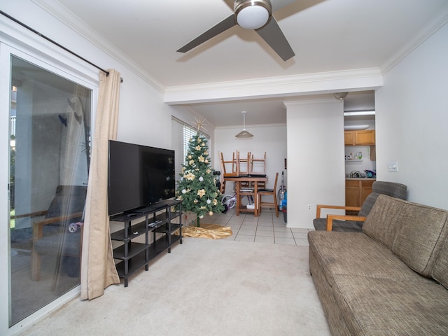 living room with ceiling fan, light tile patterned floors, and ornamental molding