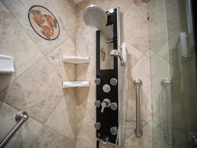 interior details featuring a tile shower