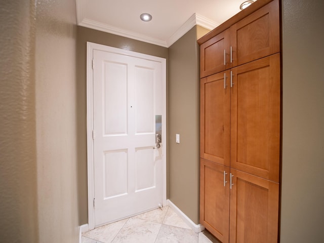 doorway with light tile patterned floors and crown molding