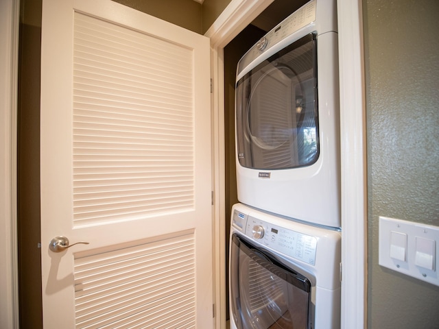 laundry room featuring stacked washing maching and dryer