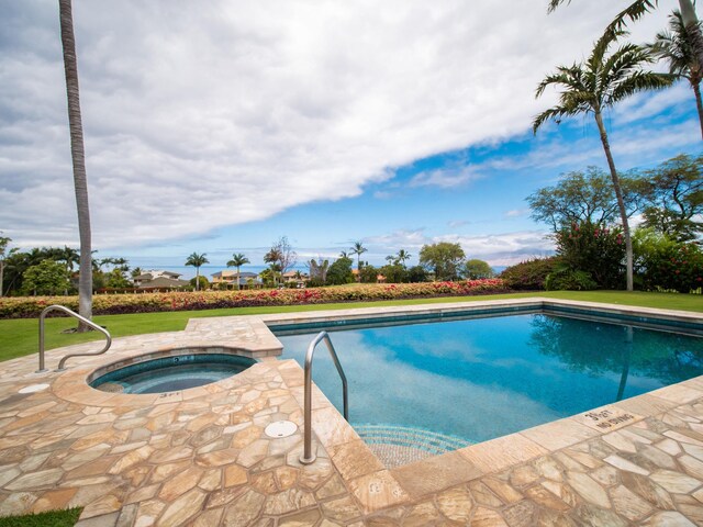 pool featuring an in ground hot tub