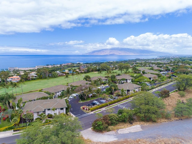 bird's eye view with a residential view and a water and mountain view