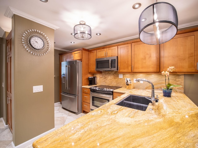 kitchen featuring stainless steel appliances, brown cabinetry, a sink, and crown molding