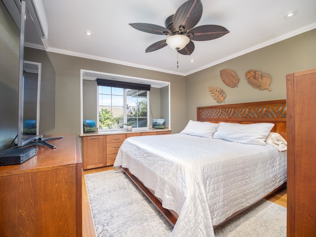 bedroom featuring ceiling fan, light hardwood / wood-style floors, and crown molding