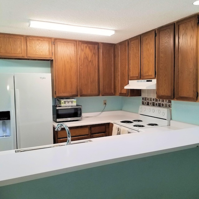 kitchen featuring sink and white appliances