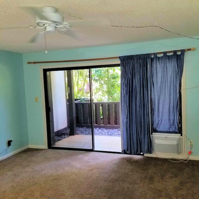 empty room with carpet, a textured ceiling, and ceiling fan