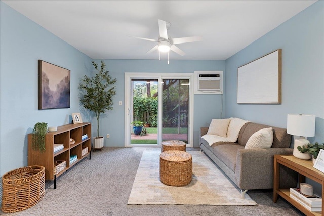 living room with ceiling fan, light colored carpet, and a wall mounted air conditioner