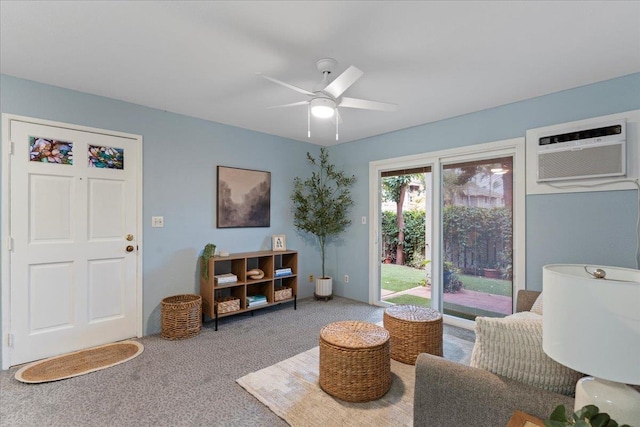 living area with an AC wall unit, ceiling fan, and carpet