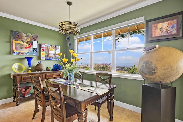 dining space featuring tile patterned floors, a wealth of natural light, ornamental molding, and a notable chandelier