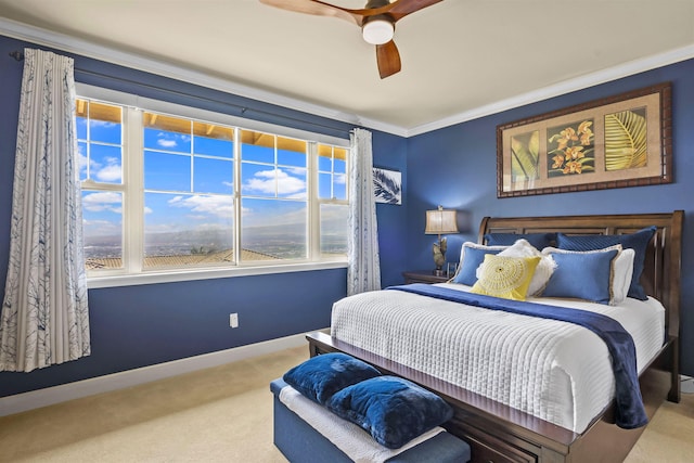 bedroom with baseboards, ornamental molding, carpet, and a ceiling fan