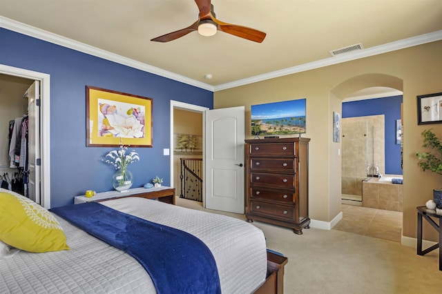 bedroom with carpet floors, arched walkways, baseboards, visible vents, and ornamental molding