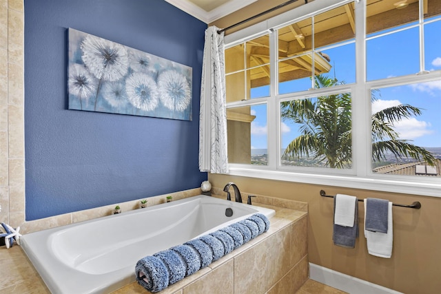full bath featuring a garden tub and ornamental molding