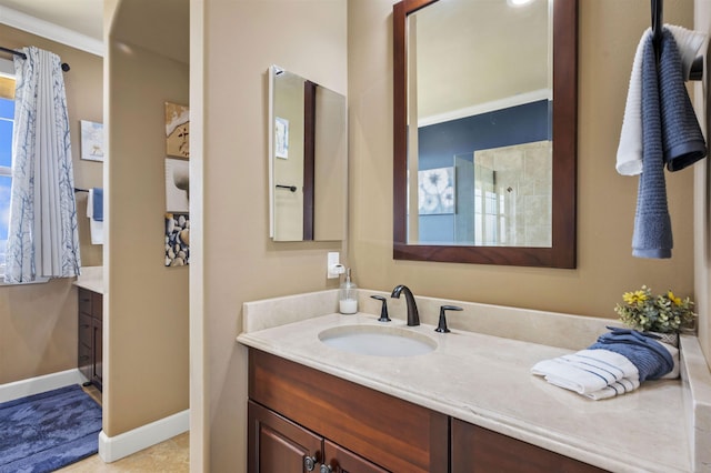 bathroom with vanity and baseboards