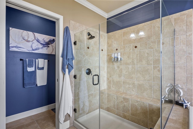 bathroom featuring crown molding, tile patterned floors, baseboards, and a shower stall