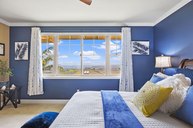 bedroom with carpet floors, baseboards, multiple windows, and ornamental molding