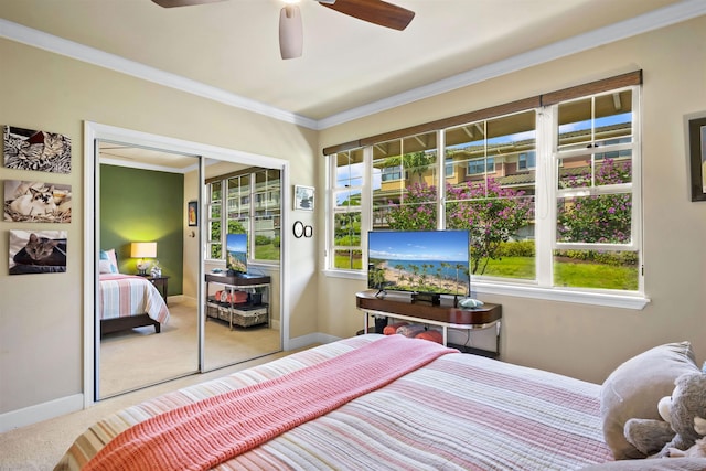 bedroom with crown molding, a closet, multiple windows, and carpet flooring