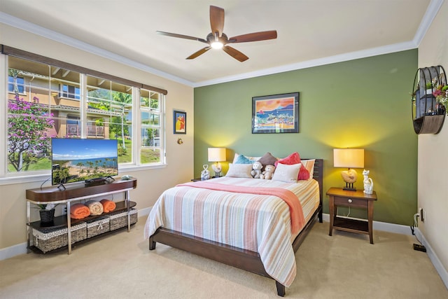 bedroom featuring carpet floors, a ceiling fan, crown molding, and baseboards