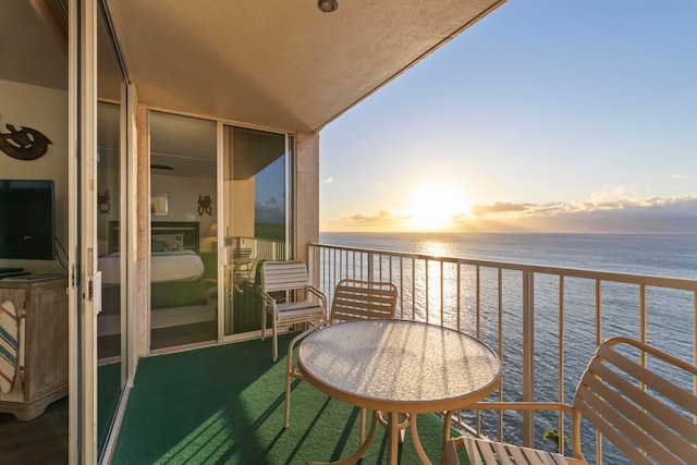 balcony at dusk with a water view
