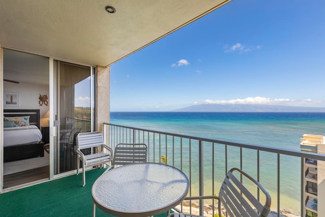 balcony featuring a water view