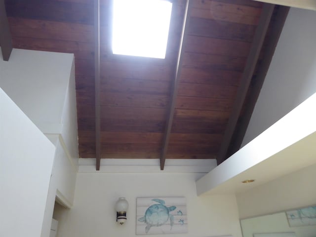 details with wooden ceiling and beamed ceiling