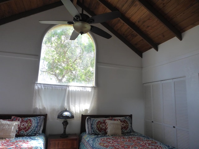 unfurnished bedroom featuring beam ceiling, multiple windows, and wooden ceiling