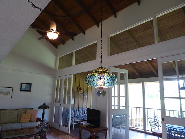 interior space featuring beam ceiling, ceiling fan, wood ceiling, and high vaulted ceiling