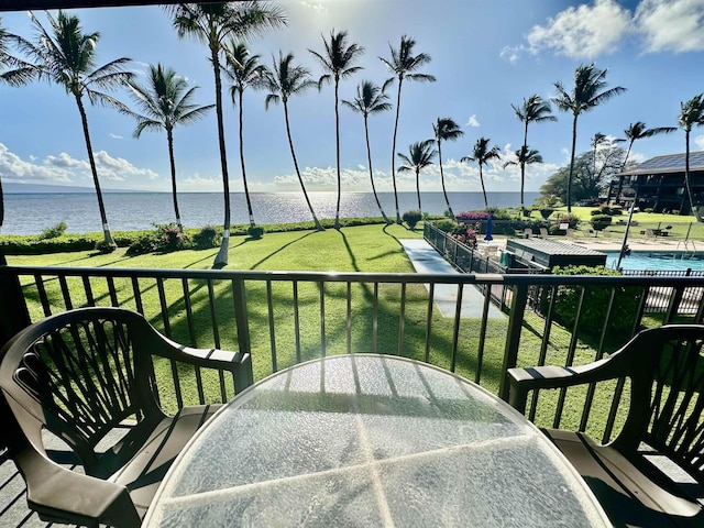 balcony featuring a water view