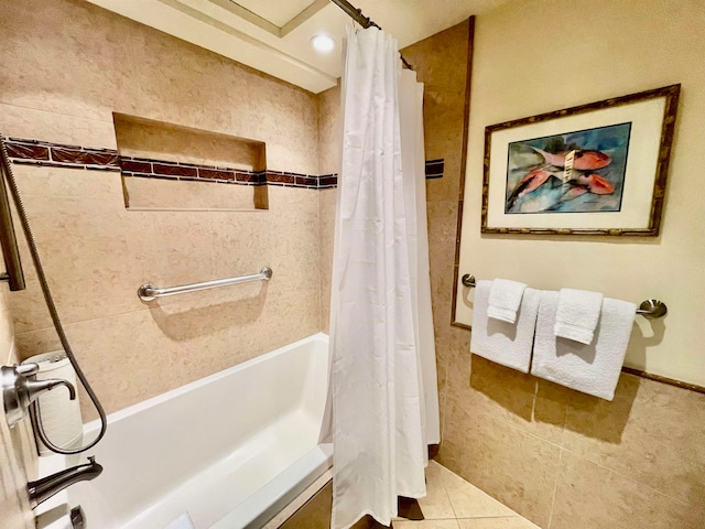 bathroom featuring tile patterned floors and shower / bath combination with curtain