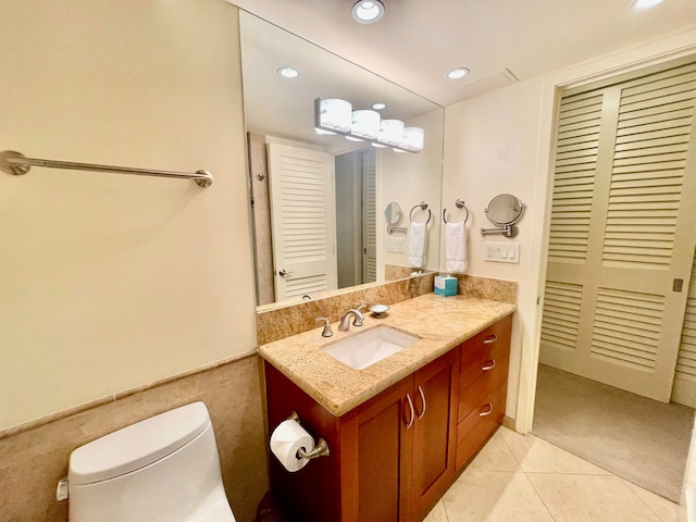 bathroom featuring vanity, toilet, and tile patterned flooring