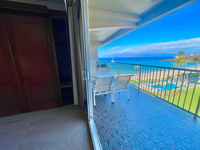 balcony featuring a water view