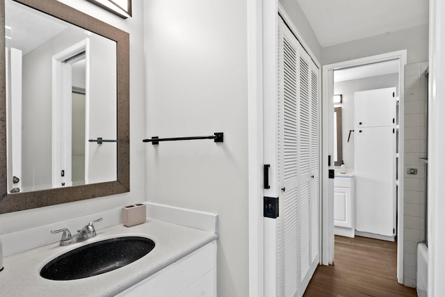 bathroom featuring hardwood / wood-style floors and vanity