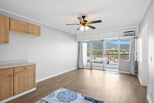 interior space featuring a wall mounted air conditioner, dark hardwood / wood-style flooring, and ceiling fan