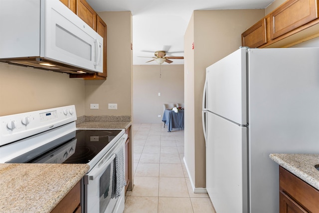 kitchen featuring white appliances, ceiling fan, and light tile patterned flooring